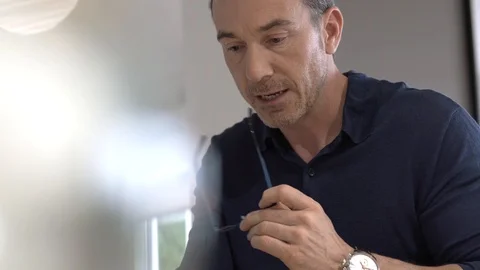 Portrait of middle-aged man connected on digital tablet Stock Footage 124524899