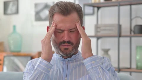 Portrait of Middle Aged Man with Headache at Home Stock Footage 287897503