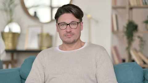 Portrait of Middle Aged Man Looking at Camera at Home 스톡 동영상 142372523