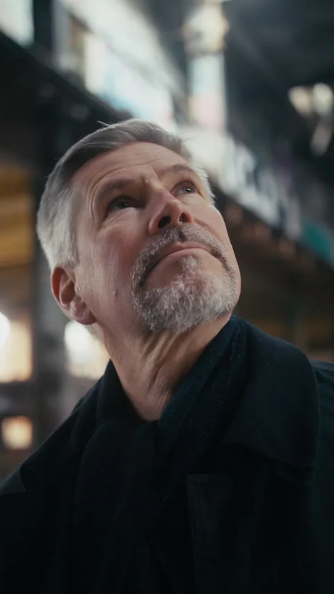 Portrait of middle aged man looking around an abandoned building. Video stock 300791870