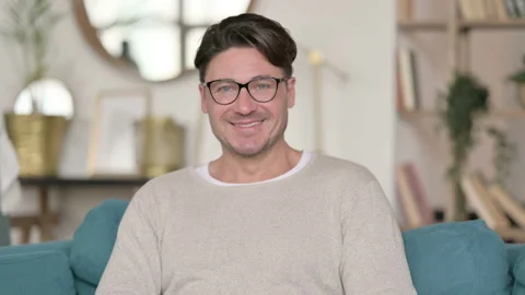 Portrait of Middle Aged Man Smiling at Camera at Home Video stock 142370794
