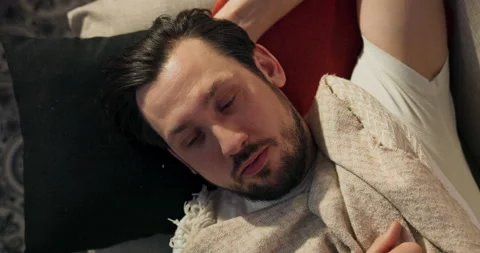 Portrait of a middle-aged man staring at the ceiling after a morning nap 库存影片 218280034