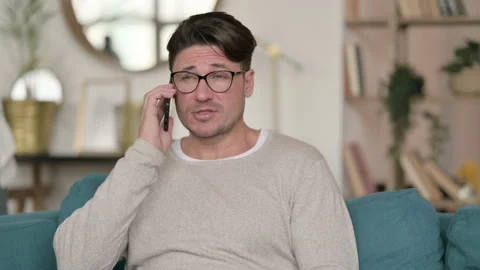 Portrait of Middle Aged Man Talking on Smartphone, at Home 스톡 동영상 142382271