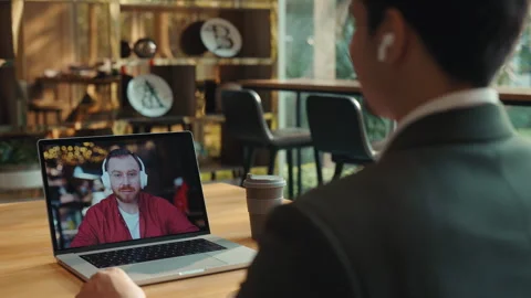 Portrait of middle aged man talks to Indian colleague online laptop screen view Stock-Footage 310637075