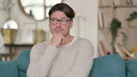 Portrait of Middle Aged Man Thinking Getting Idea at Home Video stock 142377185