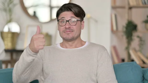Portrait of Middle Aged Man with Thumbs Up at Home 스톡 동영상 142365820