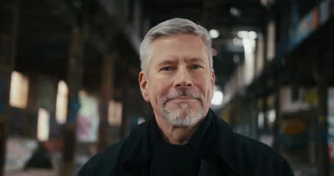 Portrait of middle aged man turning head and looking in the camera. Stock Footage 300792378