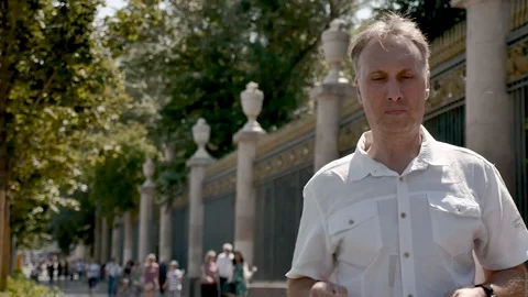 Portrait of a middle-aged man in a white shirt and sunglasses Video stock 112596822