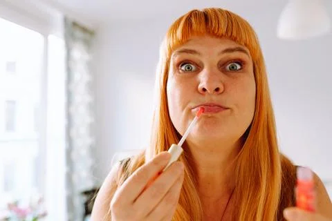 Portrait middle-aged red-haired woman Stock Photos