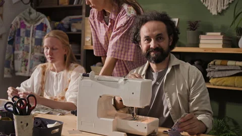Portrait of Middle Aged Tailor Smiling in Sewing Studio Stock Footage 341946923
