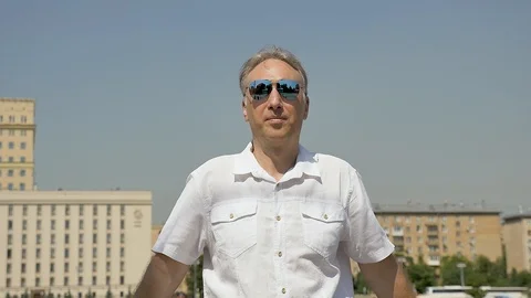 Portrait of a middle-aged white man with a balding head, big glasses Video stock 112421274