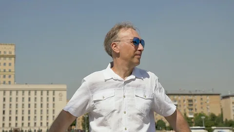 Portrait of a middle-aged white man with a balding head, big glasses Stock Footage 112421324