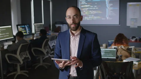 Portrait of Middle Eastern Male Computer Science Teacher with Tablet in Class Stock Footage 278125915