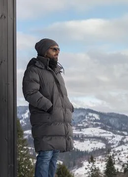 Portrait of middle eastern man looking at view of snowy mountains in Ukraine Stock Photos