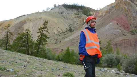 Portrait of a mining engineer, a geologist in the protective reflective vest Stock Footage 79466357