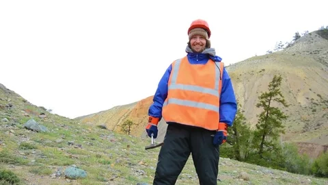 Portrait of a mining engineer, a geologist in the protective reflective vest Stock Footage 82415324