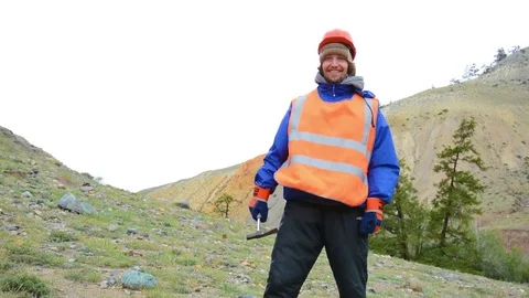 Portrait of a mining engineer, a geologist in the protective reflective vest Stock Footage 82416130