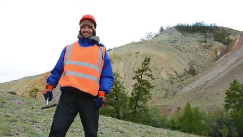 Portrait of a mining engineer, a geologist in the protective reflective vest Stock Footage 83439995