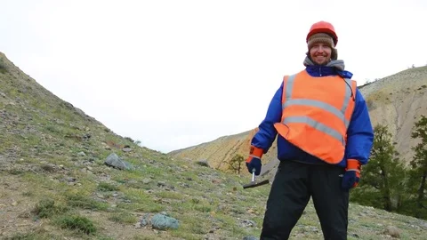 Portrait of a mining engineer, a geologist in the protective reflective vest Stock Footage 83440003