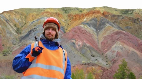 Portrait of a mining engineer, a geologist in the protective reflective vest Stock Footage 83496244