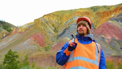 Portrait of a mining engineer, a geologist in the protective reflective vest Stock Footage 83496601