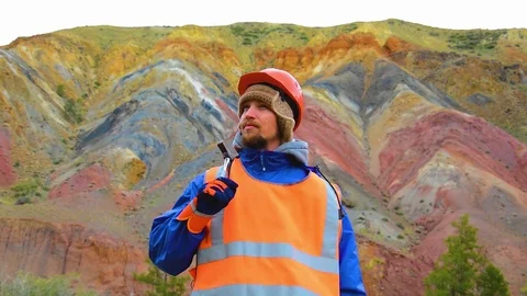 Portrait of a mining engineer, a geologist in the protective reflective vest Stock Footage 83497129