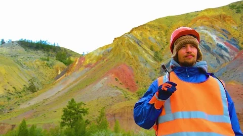 Portrait of a mining engineer, a geologist in the protective reflective vest Stock Footage 83497483