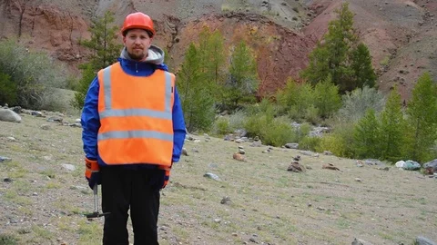 Portrait of a mining engineer, a geologist in the protective reflective vest Stock Footage 84564535