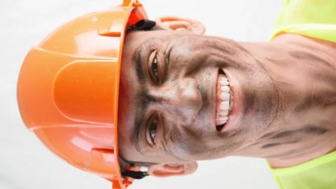 Portrait Mixed Race Guy with Dirty Face in Work Hard Hat Smiles snow-white Smile Stock Footage 148365402