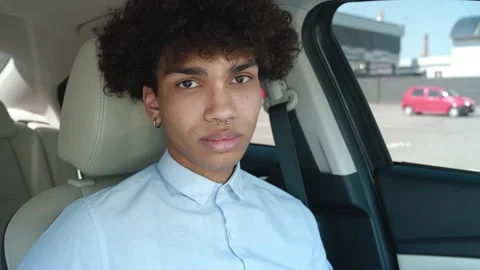 Portrait mixed race millennial guy looking at camera. Happy confident handsome Stock Footage 157980919