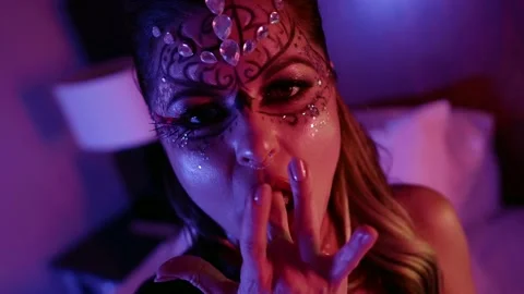 Portrait of a model with beautiful makeup, a pattern and with rhinestones on her Video stock 147372302