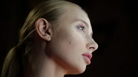 Portrait of a model with a flowing down paint on the face. Stock Footage 67317864