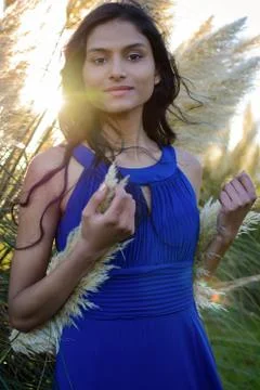 Portrait of model posing in front of Pampas grass in Sligo in Ireland. Stock Photos
