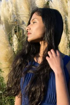 Portrait of model posing in front of Pampas grass in Sligo in Ireland. Stock Photos