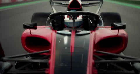 Portrait of modern formula one  race car pilot driving fast during a race Stock Footage 245545418