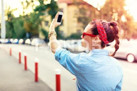 Portrait of modern girl taking selfies at music festival. Happy summer portrait Stock Photos