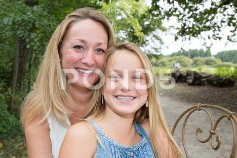 Portrait of mother and her teenage daughter outdoor in nature Stock Photos