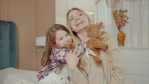 Portrait of a mother lovingly embracing her daughter. Mother's Day concept. Stock Footage 234989691