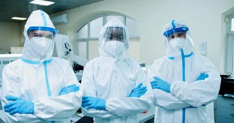 Portrait of multi-ethnic different doctors medical scientist in protective suits Foto stock