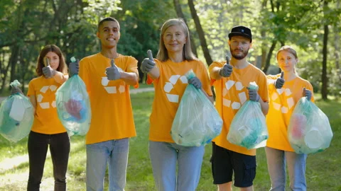 Portrait Multi-Ethnic Group of Eco-Activists Showing Thumbs Up After Cleaning Stock Footage 236373797