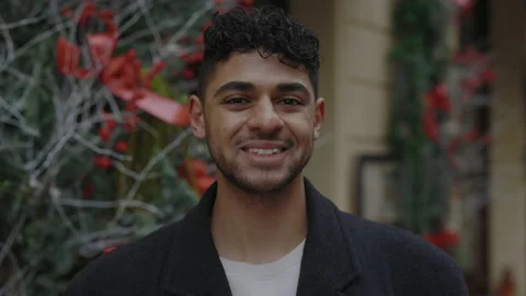 Portrait of the multi ethnic man standing outside looking at camera and smiling Stock Footage 224341569
