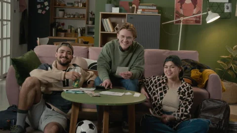 Portrait of Multiethnic Students Smiling While Calculating Household Expenses Stock Footage 336623569