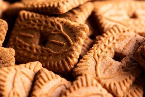 A portrait of multiple brown cookies called speculoos or speculaas in Belgi.. Stock Photos