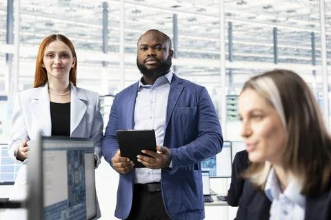 Portrait of multiracial team modeling integrated circuit systems in RD office Stock Photos