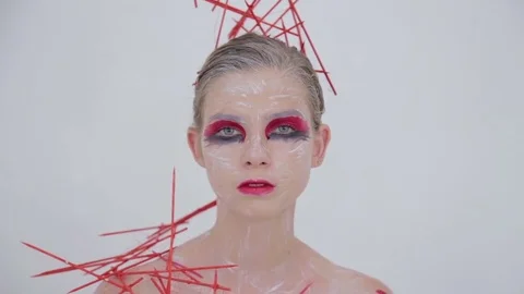 Portrait of mysterious girl with creative make-up and elegant hairstyle Video stock 73973953