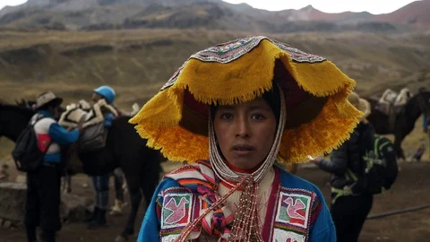Portrait of a Native Peruvian wearing typical clothes in the Rainbow Mountain Stock Footage 125282617