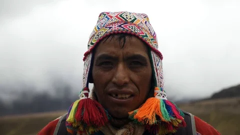 Portrait of a Native Peruvian  wearing typical clothes in the Rainbow Mountain Stock Footage 125282668