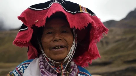 Portrait of a Native Peruvian  wearing typical clothes in the Rainbow Mountain Stock Footage 125282694