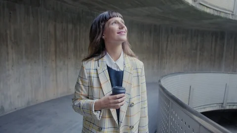 Portrait of a nice and cute pensive woman enjoying free walk around urban city Stock Footage 105752907