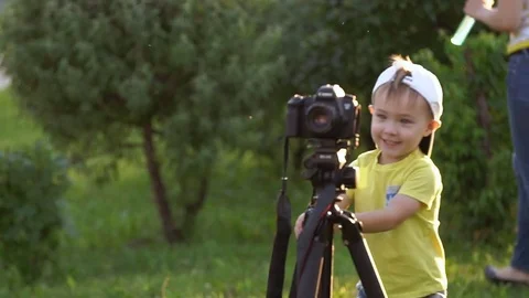 Portrait of nice boy with a professional camera Stock Footage